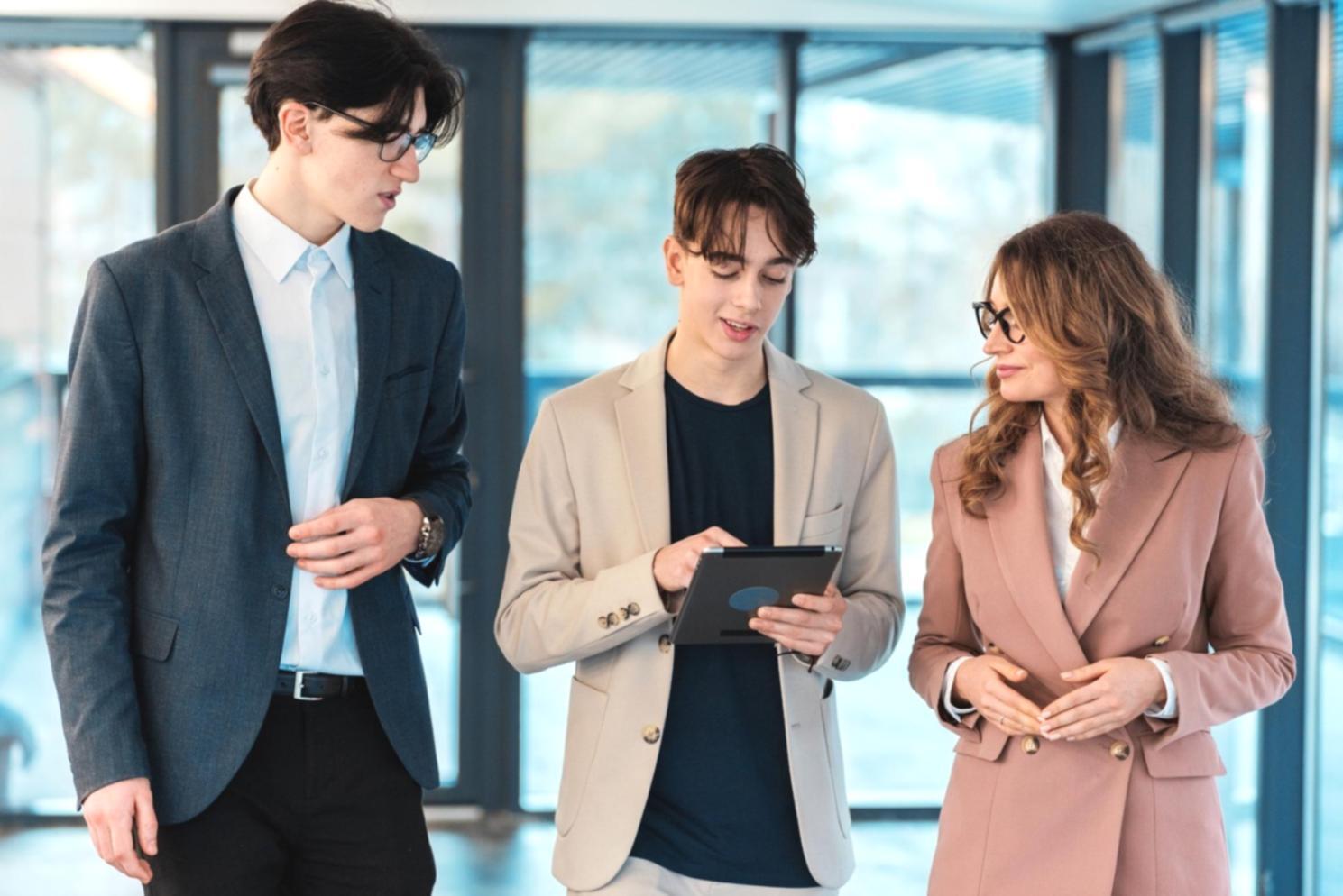 Students working together on financial planning exercises with calculators and worksheets